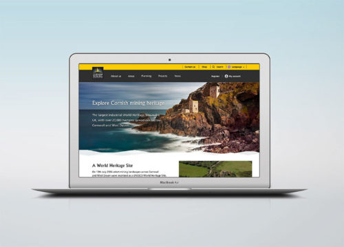 A macbook featuring the homepage of the Cornish Mining website