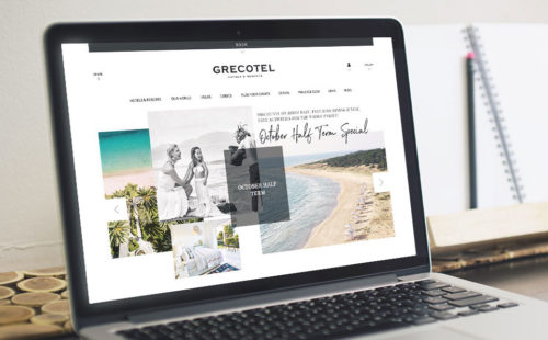 A close up on a macbook screen featuring the homepage of the Grecotel website